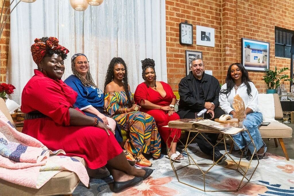 Members of the Media 2070 team sit within the Black Future Newsstand exhibit